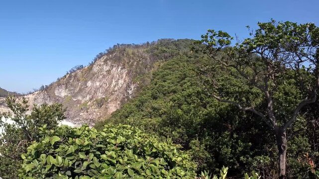 Scenic View of Kawah Putih Volcanic Crater Lake in Ciwidey West Java, Indonesia on a Sunny Day with Blue Sky and No People