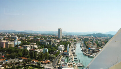 Naklejka premium Aerial view of Rimini cityscape with marina and mountains in the background, Italy