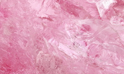 Fototapeta premium amethyst crystal displays frozen textures with cool Pink hues. The icy surface of the gemstone