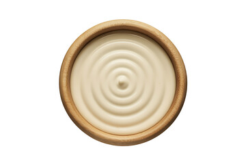 Top view of fresh white yogurt or cream with ripple texture in a wooden bowl