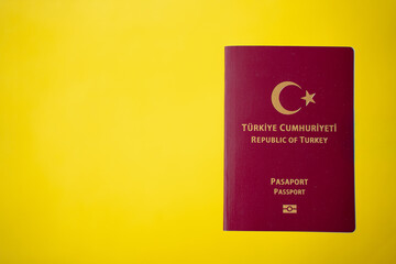Republic of T&uuml;rkiye burgundy passport on the yellow table