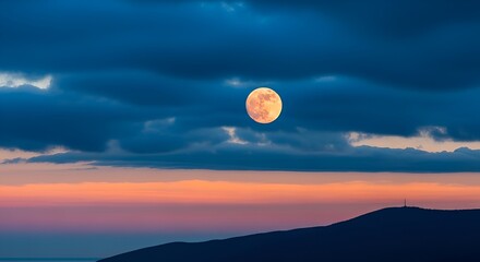 Obraz premium Full Moon Rising Over Dramatic Clouds and Coastal Hills at Sunset, Mystical Night Sky Photography for Celestial Themes and Serene Landscapes