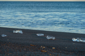 Jewelry ice scattered on sandy beach at Tokachi River estuary, Hokkaido, Japan © harumachi