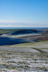 A view over snow covered fields on a misty winter's morning in Sussex