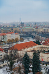 Obraz premium Prague cityscape with Vltava River and historic old town roofs winter view