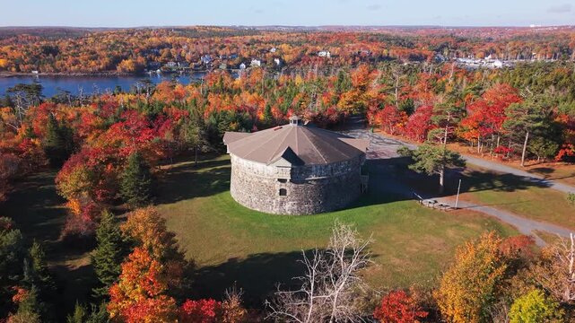 Beautiful Drone Shot Of Prince Of Wales Tower Illuminated By Soft Sunrise Light. Surrounded By Autumn Trees In Full Color In A Quiet Corner Of Halifax.