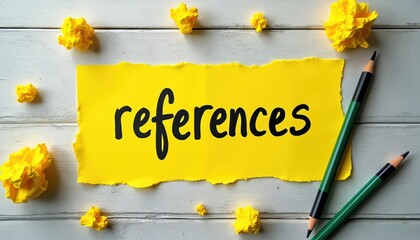 Fototapeta premium Yellow paper with the word references. Pencils and crumpled paper balls on white wood table. Idea, citation, source, education concept. Research, information, writing.