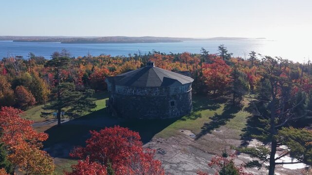Cinematic Drone View Of Prince Of Wales Tower In The Middle Of Autumn-Colored Park At Sunrise. Stunning Canadian Landscape And National Historic Site In Nova Scotia.