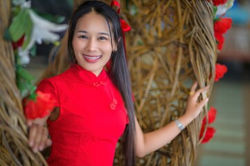 Joyful Young Woman Celebrating New Year in Traditional Red Attire