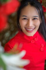 Joyful Celebration of New Year with Smiling Young Woman in Red