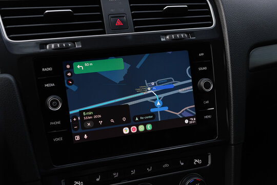 Google maps navigation on screen in modern car. Volkswagen car interior - close-up shot of infotainment system with Android auto screencast. Turning left on a street. Kyiv, Ukraine - June 07 2025