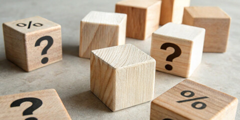 Business concept with decisions and uncertainty with wooden blocks with question marks and percentage symbols represent risk assessment.