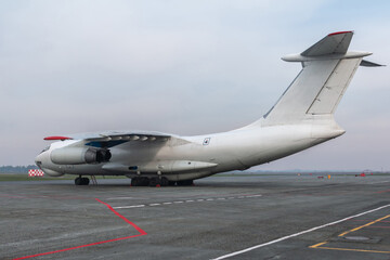 Big white transport cargo aircraft at the airport