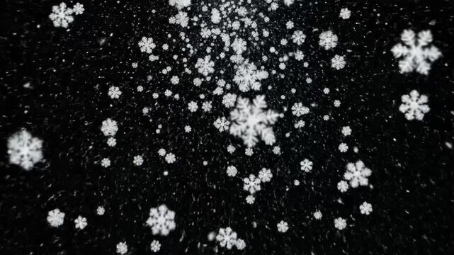 Snowflakes fall gently on a dark background during wintertime, showcasing nature's beauty in a simple moment