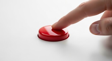 close-up of a finger about to press a red button on a white surface