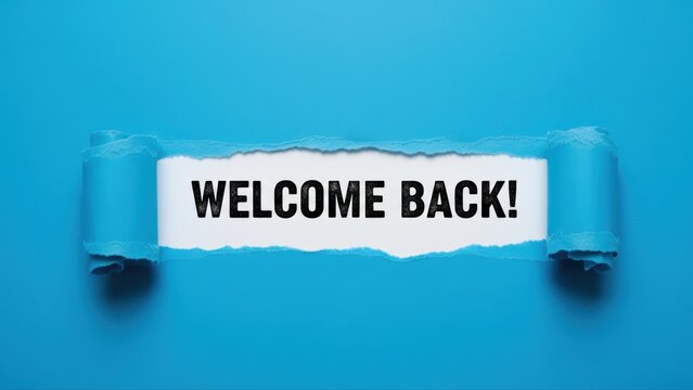Torn blue paper revealing a welcome back message for employees returning to the office.