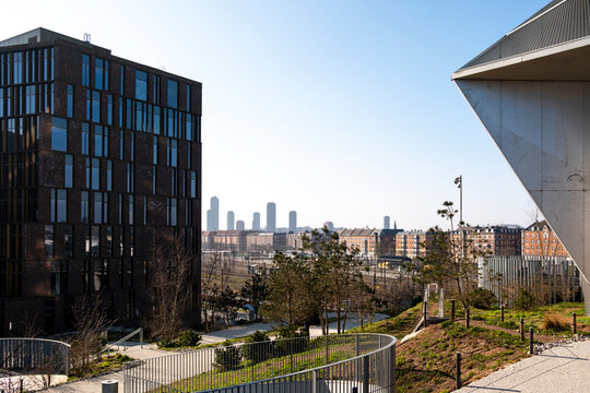 Modern urban park landscape with architecture building exterior and skyline views in Copenhagen Denmark offering calm city horizon view