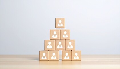 Fototapeta premium Pyramid of Wooden Blocks with Business Figure Icons Representing Corporate Hierarchy and Management Structure