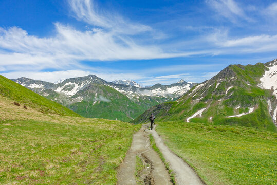 Hiking among the high mountain landscape of Grand Col Ferret, Switzerland 