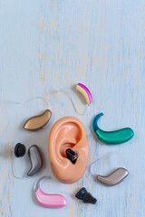 Hearing Aids Displayed on Model Ear