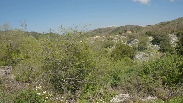 Old abandoned stone-built houses in Old Perithia at Pantokrator Mountain, Corfu. This is simply a ghost town located on the North of Corfu green island. Discover the history of greek empire