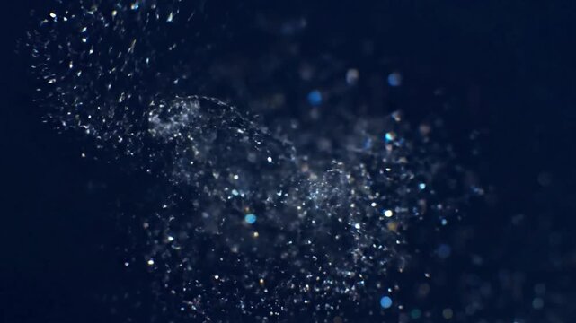 Subtle Motion Emphasize the slow, gentle drift and fluidity of the glitter.