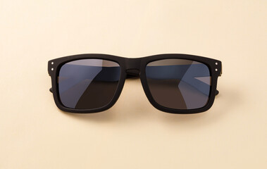 Black frame sunglasses with dark lenses protecting vision © Gresei