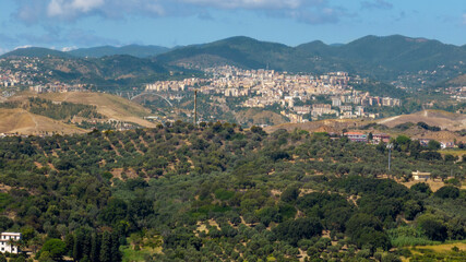 Aerial view of the Calabrian mountains. In the background, perched among the hills, lies the city of Cartanzaro, the capital of the Calabria region, Italy.