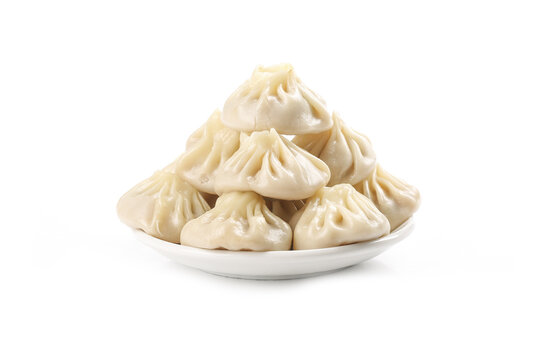 Fresh Xiaolongbao Chinese Soup Dumplings with Meat Filling on White Plate