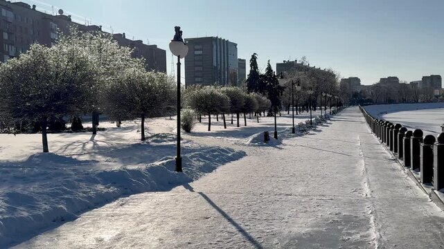 Snow-covered embankment on a sunny frosty day