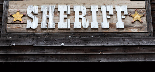 Sheriff sign on vintage background, wild west design. Concepts of justice, protection and security