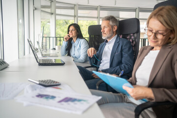 Professionals using artificial intelligence for collaboration on office project