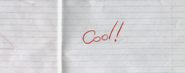 Lined notebook paper background with handwritten word Cool and number five in red pencil. Minimalist textured stationery surface, school notebook page &mdash; highest score