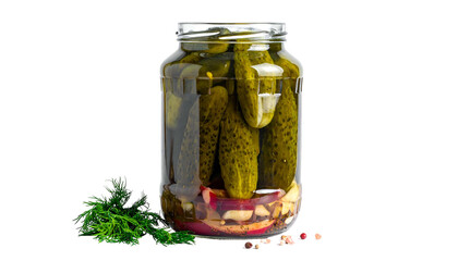 A clear glass jar filled with pickles, brine, and aromatics, set against a black backdrop