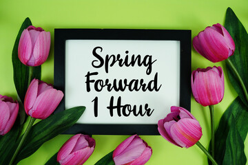 Spring Forward 1 Hour Daylight Savings Time message with bunch of flowers on green background