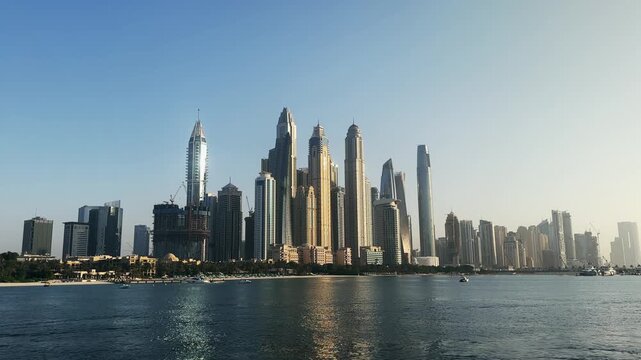 Skyline panorama of Dubai Marina with its modern skyscrapers reflecting the sunlight, no logos
