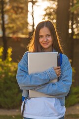 Portrait of happy student posing in university campus