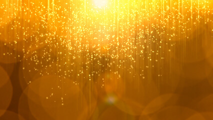 Golden particles float down in a bright setting © Iryna