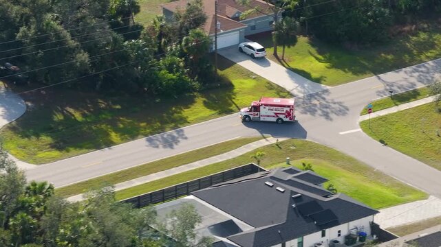 Fire rescue truck drive on Florida road. Emergency service vehicle on city street in USA.