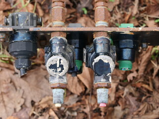 Components of a truck's compressed air brake system with red and blue spiral hoses