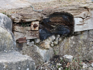 old, well-used wooden buffer stop for trains