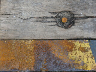 black and yellow warning markings in front of a wooden plank