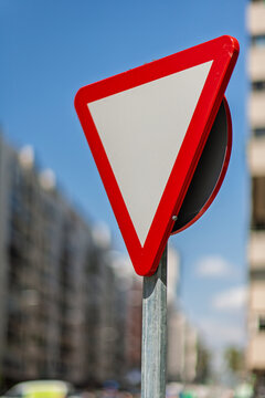 Vibrant Yield Sign on Seville Street with Bokeh Urban Background
