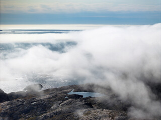 View of the waterfront infrastructure in Tasiilaq, Greenland.  Clouds on the town