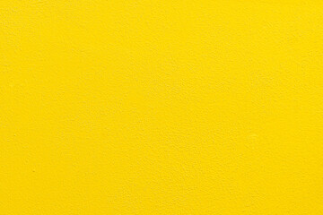 ellow concrete wall texture background. Uneven render stucco painted concrete wall texture background. Rough and grunge wall.