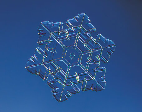 Natural snowflake crystal in blue background