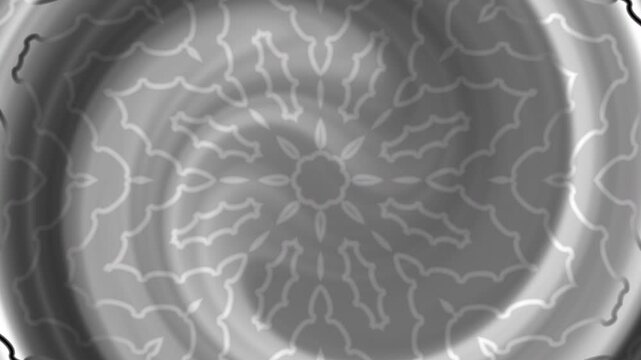 Close up grayscale mandala radial ripple pattern featuring concentric floral motifs and subtle textures ideal for backgrounds graphic design web and abstract compositions.