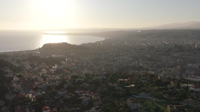 Sunset over dense city of Nice drone video, France 4K