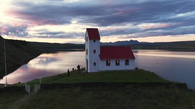Aerial Pan of &THORN;ingvallakirkja Church by Lake &THORN;ingvallavatn at Sunset in Iceland