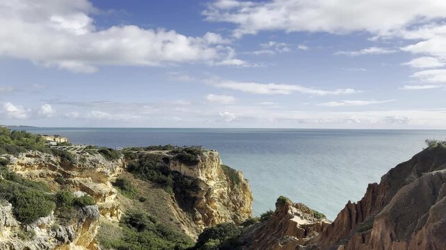 Landscape with natural arch, near Praia da Marinha, one of the most famous place of Portugal, located on the Atlantic coast in Lagoa, Algarve